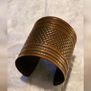 Metal Wrist Cuff Bronze Color 2.5" X 2 around 1. 25" opening 2.5" wide